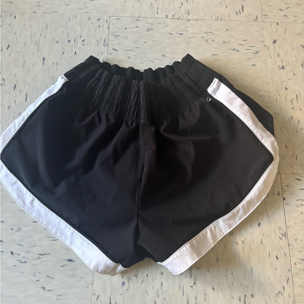 DSG black shorts with white stripe on both sides